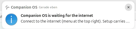 A desktop notification from Companion OS titled Companion OS is waiting for the internet, with the text Connect to the internet (menu at the top right). Setup carries on by itself.